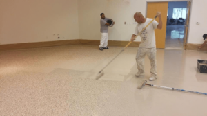 A team of commercial property painters working on a paiting project.
